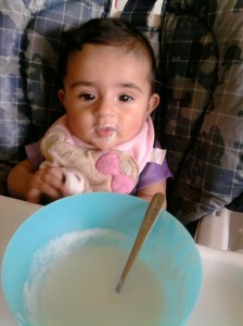Trying rice cereal at 4 months.